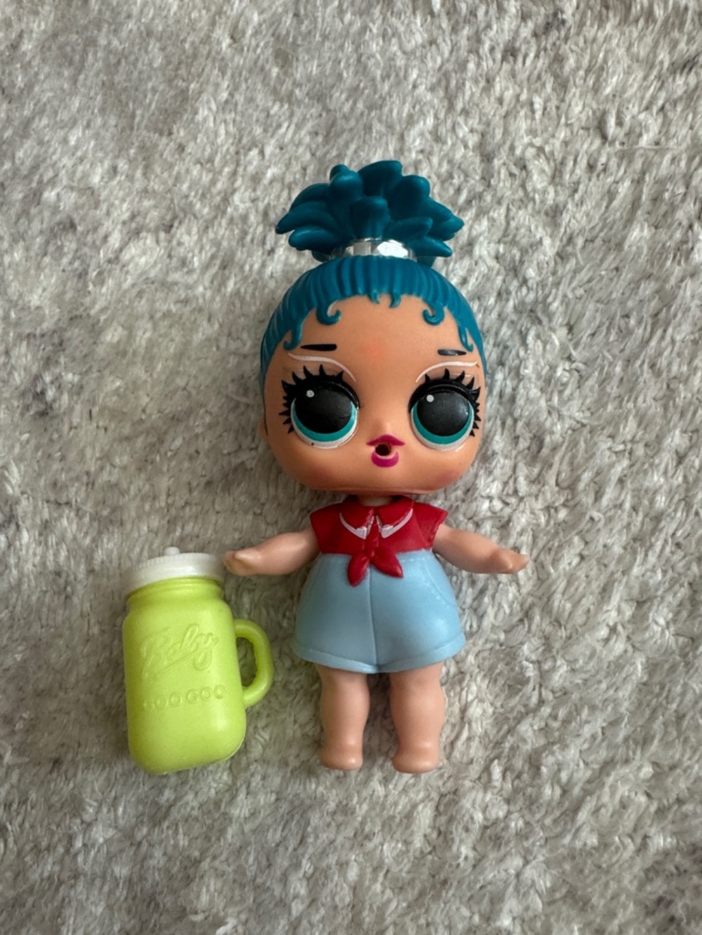 L.O.L. Surprise! Teal-Haired Doll with Red Collar and Light Blue Outfit